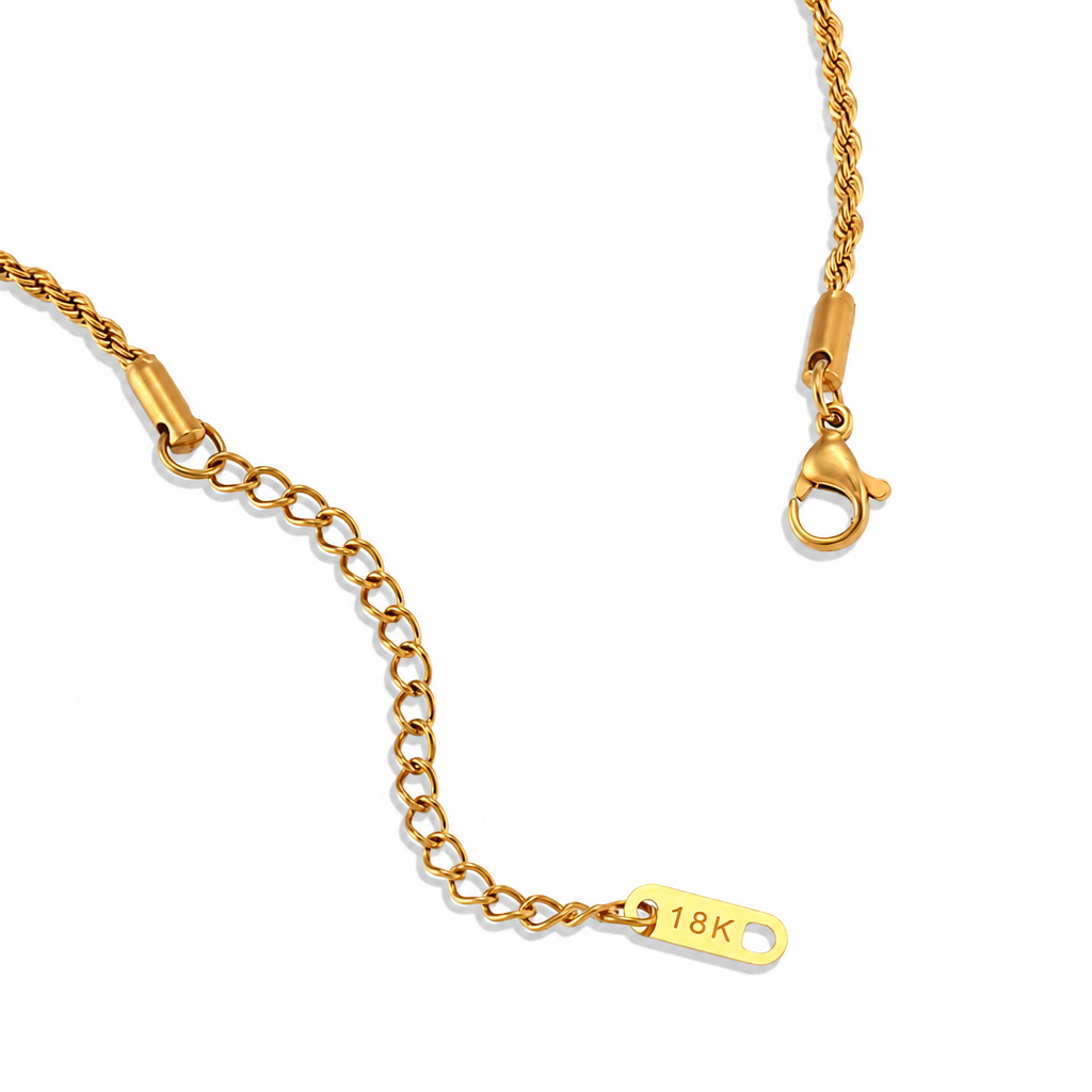 Gold necklace clasp and extension chain on white background