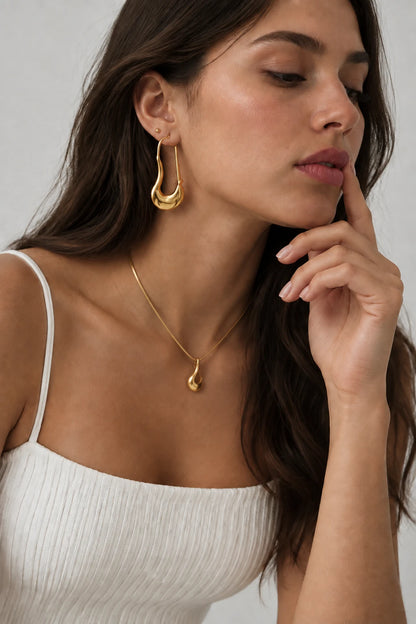 Geometric Statement Hoops in gold by C'Bella Jewelry