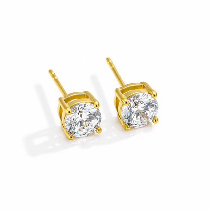 Pair of gold-plated stud earrings with clear round stones